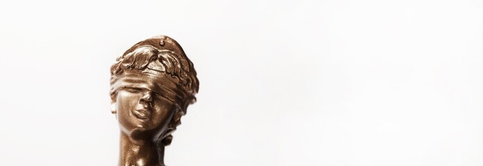 Justice blindfolded lady holding scales and sword statue © busra