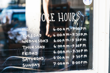Obraz premium store hours written on glass