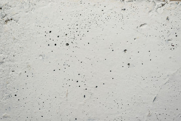 white concrete wall with peeling paint on the whole frame