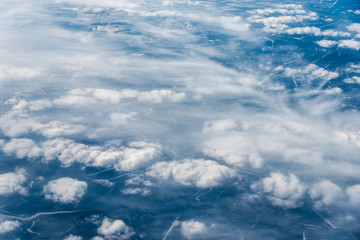 Top view of white clouds above the city