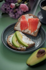 Launch with Dietary sandwiches with grain bread, cream cheese and avocado
