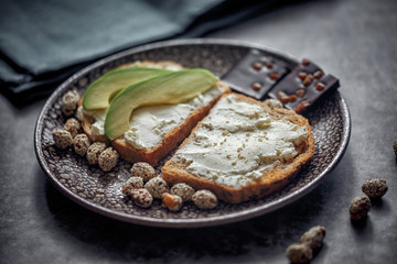Launch with Dietary sandwiches with grain bread, cream cheese and avocado
