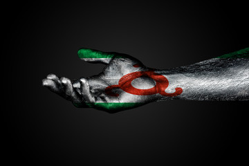 Outstretched hand with a drawn Ingushetia flag, a sign of help or a request, on a dark background.