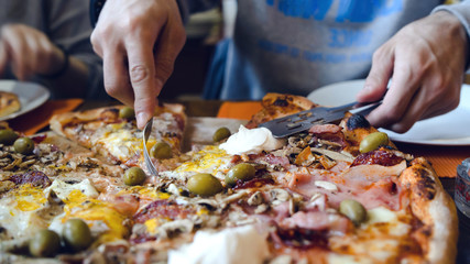 Close up on the slice Pizza On the table at the restaurant