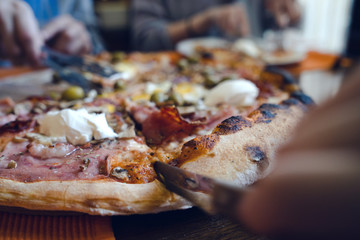 Close up on the slice Pizza On the table at the restaurant