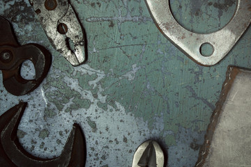 Wrench. Metal background with scratches. Garage service. Tools for repair. Free space for inscriptions.