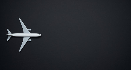 Mockup airplane isolated on black background , travel concept .