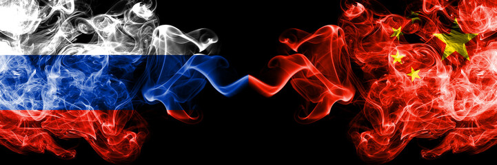 Russian vs China, Chinese smoke flags placed side by side. Thick colored silky smoke flags of Russia and China, Chinese