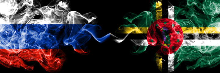 Russian vs Dominica smoke flags placed side by side. Thick colored silky smoke flags of Russia and Dominica