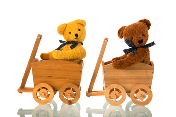 Stuffed toys bears in wooden cart