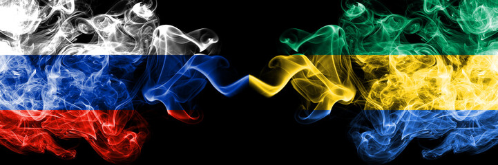 Russian vs Gabon, Gabonese smoke flags placed side by side. Thick colored silky smoke flags of Russia and Gabon, Gabonese