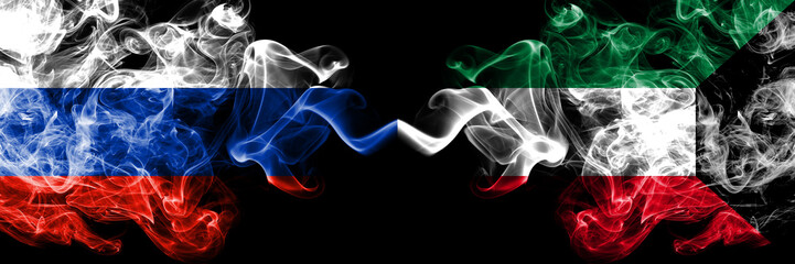 Russian vs Kuwait, Kuwaiti smoke flags placed side by side. Thick colored silky smoke flags of Russia and Kuwait, Kuwaiti