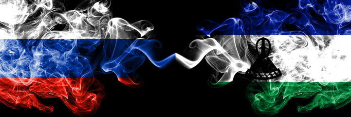 Russian vs Lesotho smoke flags placed side by side. Thick colored silky smoke flags of Russia and Lesotho
