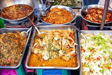 delicious fresh street food in Thailand - top view - Thai Curry, Tamarind, Tom Yam, Shrimp, Pork, Pad Thai