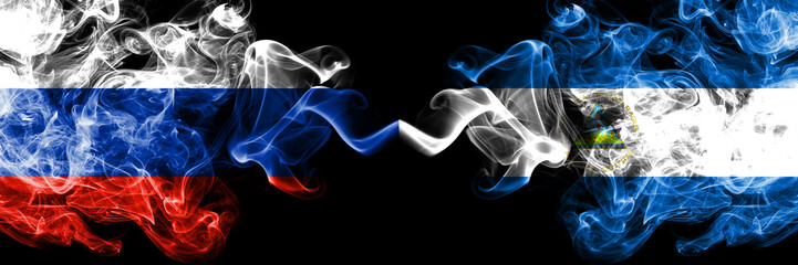 Russian vs Nicaragua, Nicaraguan smoke flags placed side by side. Thick colored silky smoke flags of Russia and Nicaragua, Nicaraguan