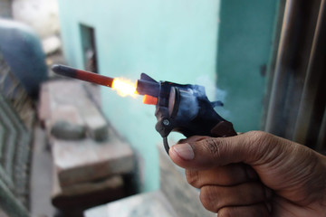 Shot of Toy Gun with flash on Diwali Occasion