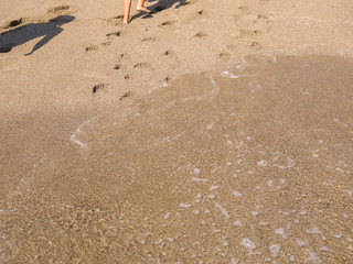 beach sand and bare feet