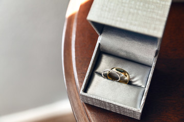Wedding rings collected in a grey box on wedding ceremony day