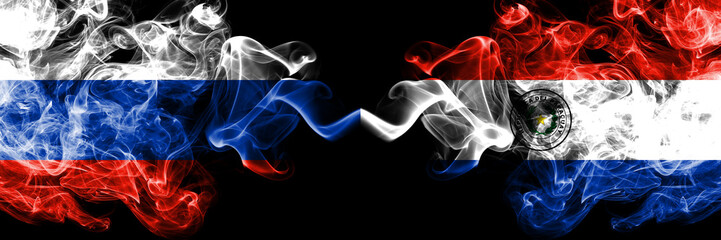 Russian vs Paraguay, Paraguayan smoke flags placed side by side. Thick colored silky smoke flags of Russia and Paraguay, Paraguayan