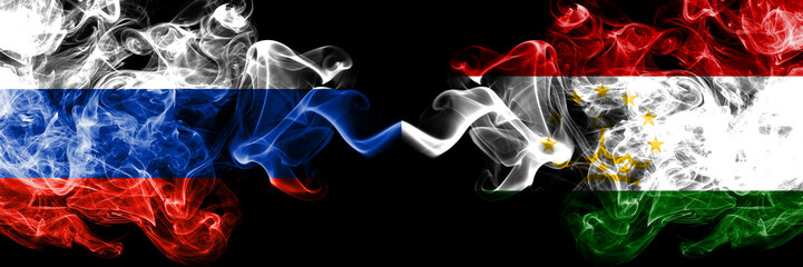 Russian vs Tajikistan, Tajikistani smoke flags placed side by side. Thick colored silky smoke flags of Russia and Tajikistan, Tajikistani