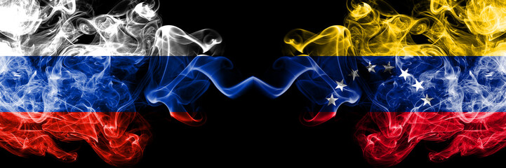 Russian vs Venezuela, Venezuelan smoke flags placed side by side. Thick colored silky smoke flags of Russia and Venezuela, Venezuelan