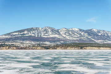 early spring landscape of frozen Columbia Lake Regional District of East Kootenay Canada.