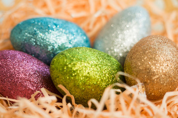 Beautiful Easter eggs decorated with sparkles. Close-up, soft focus, selected focus.