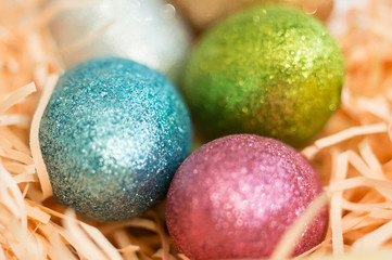 Beautiful Easter eggs decorated with sparkles. Close-up, soft focus, selected focus.