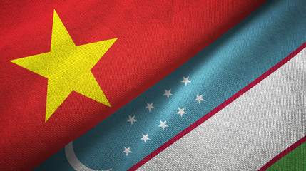 Vietnam and Uzbekistan two flags textile cloth, fabric texture