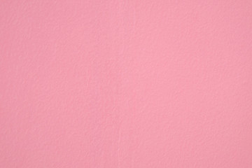 Closeup of entire pastel pink color grunge textured wall