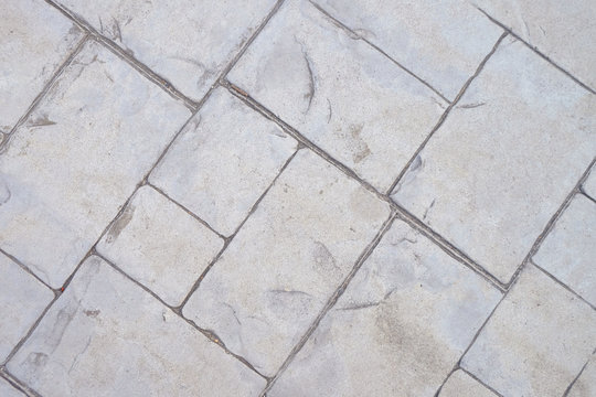 Top view rectangular cement tile on the ground in diagonal axis
