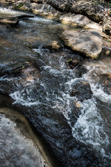 Waterfall in the nature and stone background