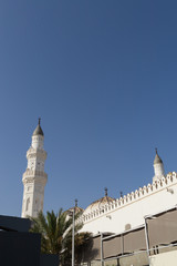 Mosque tower with copy space bright blue sky