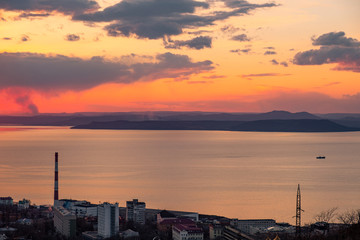 Panoramic view of the city of Vladivostok against the sunset.