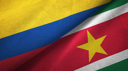 Colombia and Suriname two flags textile cloth, fabric texture