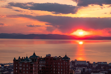 Panoramic view of the city of Vladivostok against the sunset.