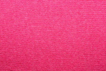 The texture of the knitted red fabric for the background 