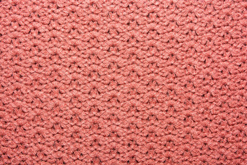 The texture of the knitted red fabric for the background 