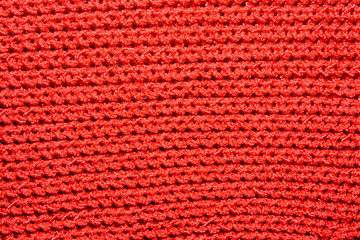 The texture of the knitted red fabric for the background 