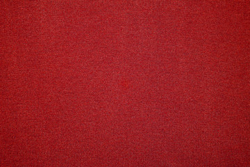 The texture of the knitted red fabric for the background 