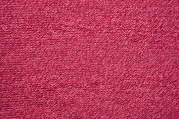 The texture of the knitted red fabric for the background 