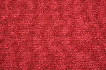 The texture of the knitted red fabric for the background 