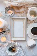 Beautiful candles, cup of coffee on white background, frame for your text, flat lay, top view, relax morning concept