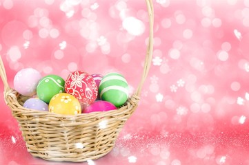 Fototapeta na wymiar Easter basket filled with colorful eggs on a white background