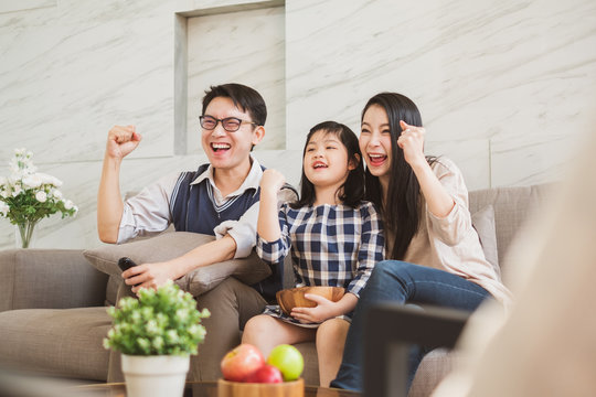 Happy Asian Family Lifestyle Enjoy Watching TV At Home