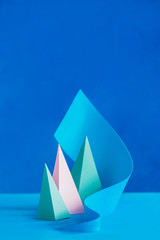 Origami papercraft sculpture in pastel tones. Vibrant design template with modern shapes and copy space