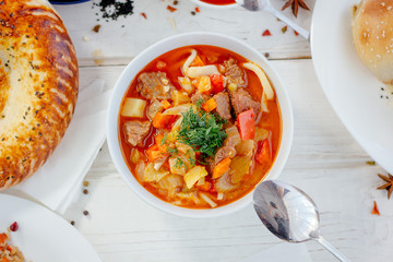 Top view of lagman or laghman uygur dish on white table.