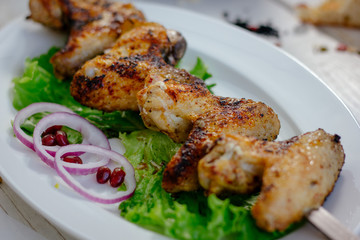 Chiken wings prepared on grill.