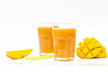 Fresh tropical fruit smoothie mango juice and fresh mango on a white background. Copy space.