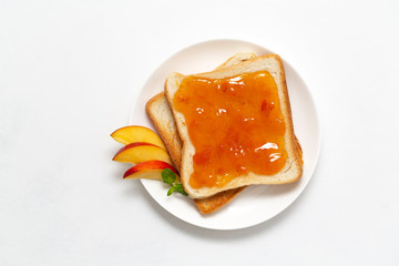 Delicious toasts with sweet jam on white background
